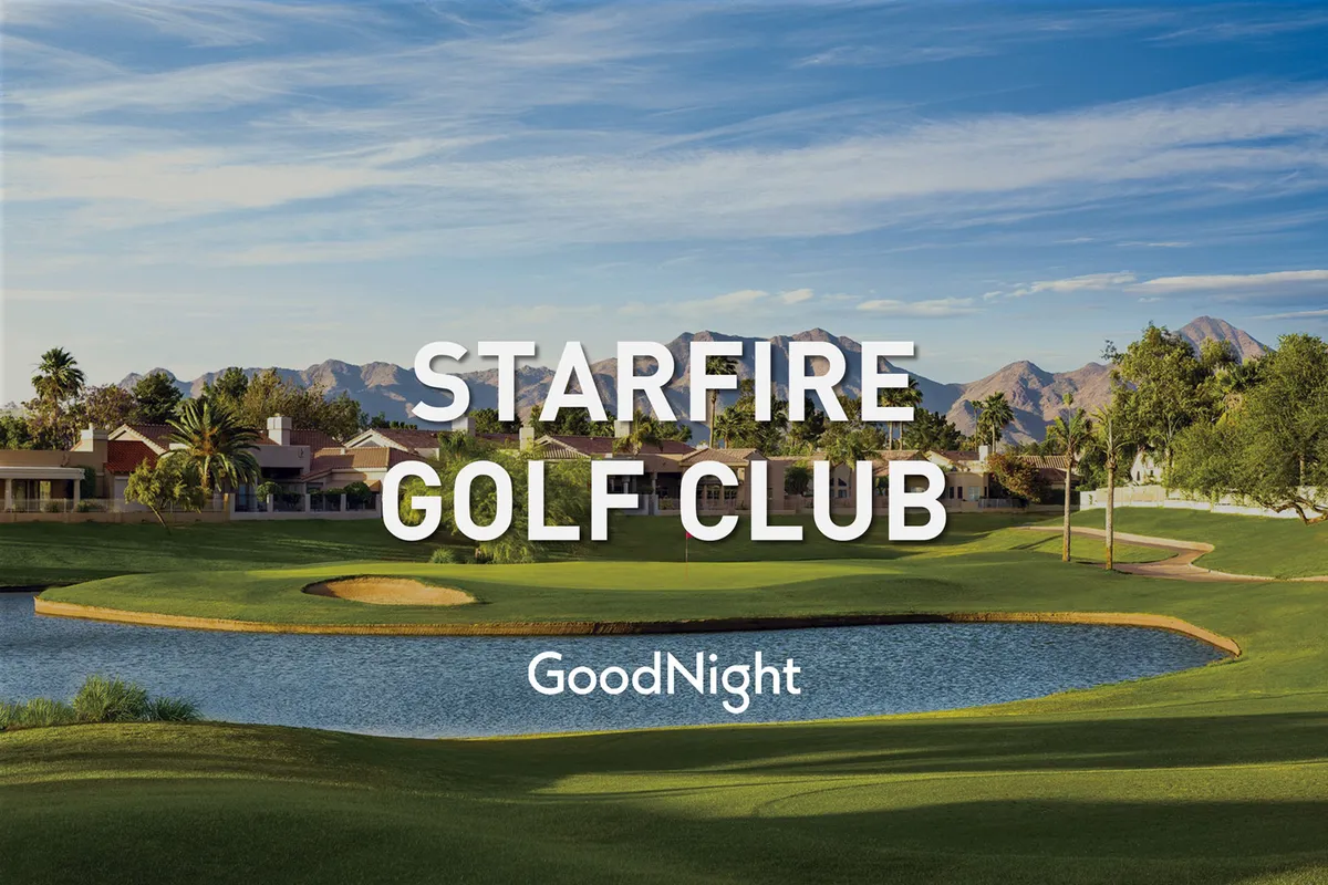 A scenic exterior of a local golf course featuring a lake, palm trees, manicured greens, mountains, and nearby residential buildings. The tranquil and recreational setting emphasizes the beauty and accessibility of Scottsdale’s premier golf destinations.